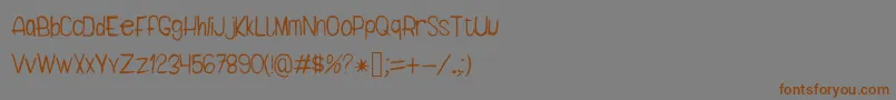 フォントDarb – 茶色の文字が灰色の背景にあります。