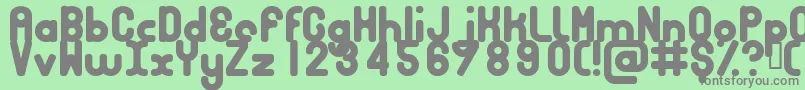 Bubbcb-fontti – harmaat kirjasimet vihreällä taustalla