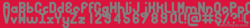 フォントBubbcb – 赤い背景に灰色の文字