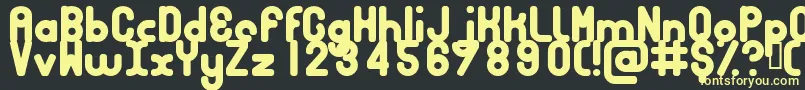 フォントBubbcb – 黒い背景に黄色の文字