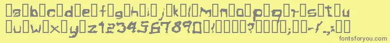 フォントElectamineOddtype – 黄色の背景に灰色の文字