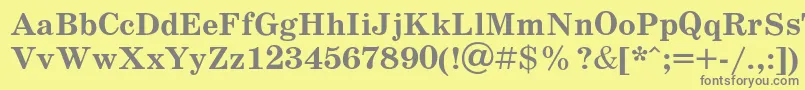 Schoolb-fontti – harmaat kirjasimet keltaisella taustalla