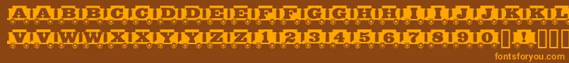 Grandfunkrr Font – Orange Fonts on Brown Background