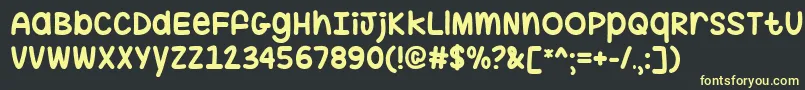 フォントHugMeTightTtf – 黒い背景に黄色の文字