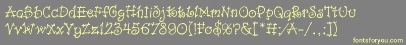 DancinLetPlain.1.0 Font – Yellow Fonts on Gray Background