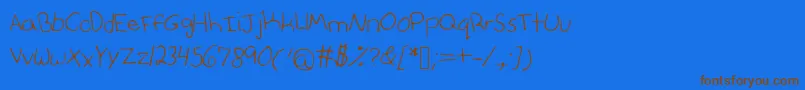 Anniesfontwithfaces Font – Brown Fonts on Blue Background