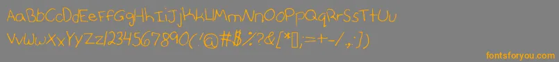 Anniesfontwithfaces Font – Orange Fonts on Gray Background