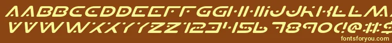 PlanetSExpandedItalic-fontti – keltaiset fontit ruskealla taustalla