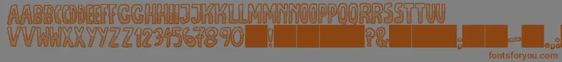 JmhEscamasWhiteDown Font – Brown Fonts on Gray Background