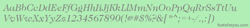 CaslonBookitalic-fontti – harmaat kirjasimet vihreällä taustalla