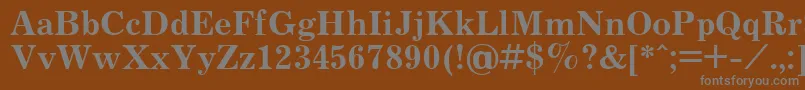 JournalBold.001.001-fontti – harmaat kirjasimet ruskealla taustalla