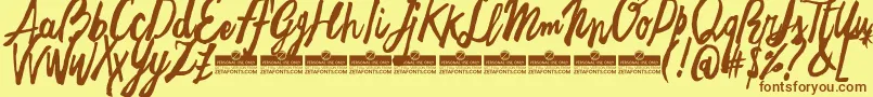 FreehandBrushTrial-Schriftart – Braune Schriften auf gelbem Hintergrund