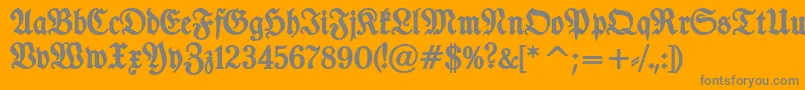 Fonte TypographerfrakturBold – fontes cinzas em um fundo laranja