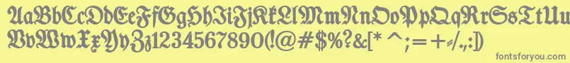 TypographerfrakturBold-Schriftart – Graue Schriften auf gelbem Hintergrund