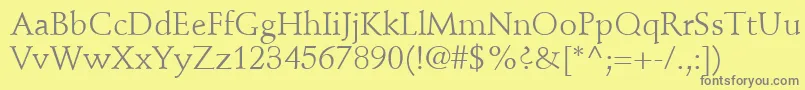 StempelSchneidlerLtRoman-fontti – harmaat kirjasimet keltaisella taustalla