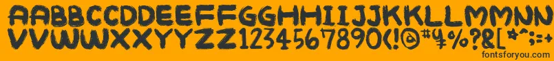 Mukokusekikitchen Font – Black Fonts on Orange Background