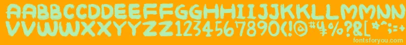 Mukokusekikitchen Font – Green Fonts on Orange Background