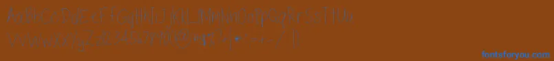 TippytoesSkinny-Schriftart – Blaue Schriften auf braunem Hintergrund