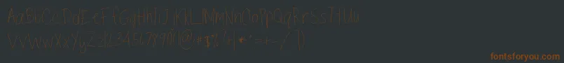 TippytoesSkinny-Schriftart – Braune Schriften auf schwarzem Hintergrund