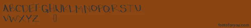 Dressinup Font – Black Fonts on Brown Background