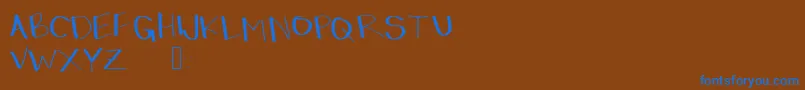 Dressinup-Schriftart – Blaue Schriften auf braunem Hintergrund
