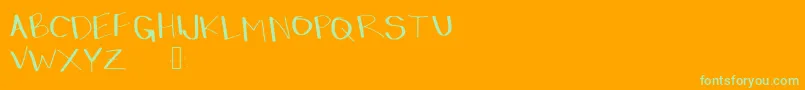 Dressinup-Schriftart – Grüne Schriften auf orangefarbenem Hintergrund