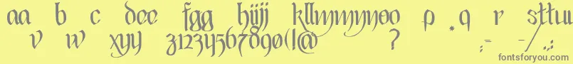 BlackHeartInertia-fontti – harmaat kirjasimet keltaisella taustalla