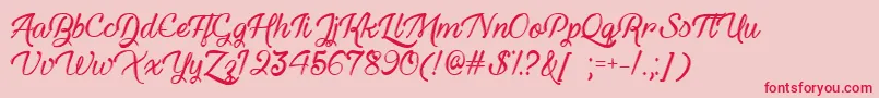 HauntedEyesTtf-Schriftart – Rote Schriften auf rosa Hintergrund