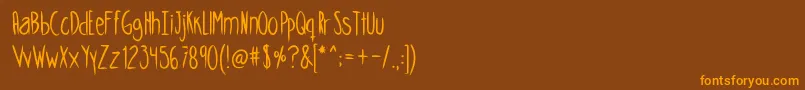 Skinnycookiesbold-Schriftart – Orangefarbene Schriften auf braunem Hintergrund