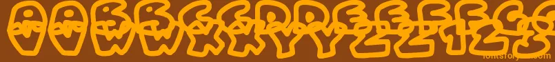 Fonte FatWobbleOutlines – fontes laranjas em um fundo marrom