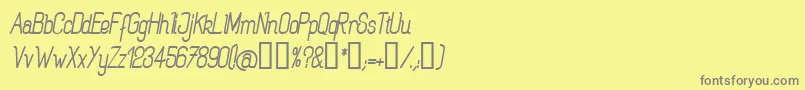 フォントRogabi – 黄色の背景に灰色の文字