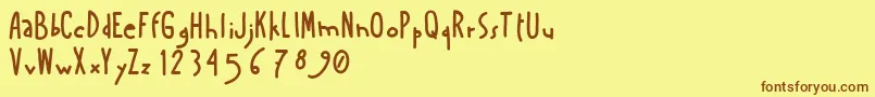 フォントAmanoboldensada – 茶色の文字が黄色の背景にあります。