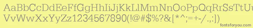 EgyptiennestdLightRegular-fontti – harmaat kirjasimet keltaisella taustalla
