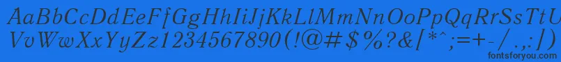 QuantantiquacItalic Font – Black Fonts on Blue Background