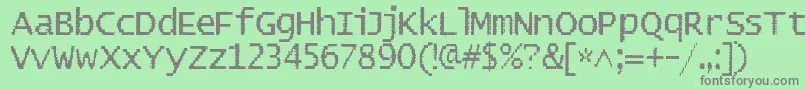 フォントBadpad – 緑の背景に灰色の文字