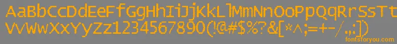 フォントBadpad – オレンジの文字は灰色の背景にあります。