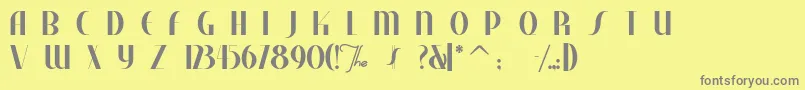 フォントStudebaker – 黄色の背景に灰色の文字