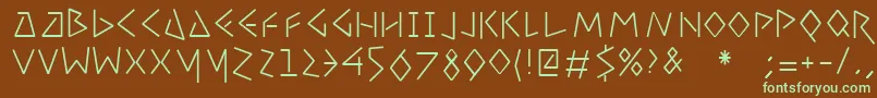 フォントUncialcondensedfifty – 緑色の文字が茶色の背景にあります。