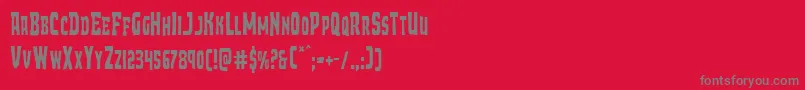 フォントDemonpriestcond – 赤い背景に灰色の文字