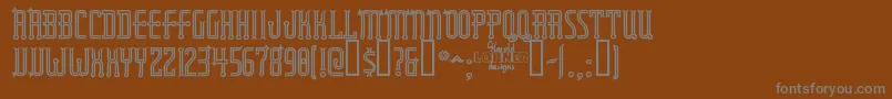 Шрифт Rubaiyatengraved – серые шрифты на коричневом фоне
