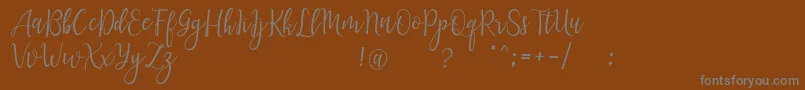 Шрифт LanaraScriptDemo – серые шрифты на коричневом фоне