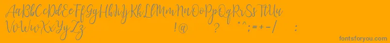 フォントLanaraScriptDemo – オレンジの背景に灰色の文字
