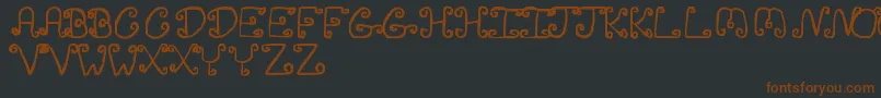InsanityJv-fontti – ruskeat fontit mustalla taustalla