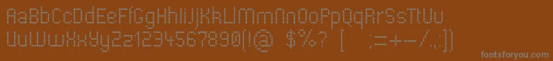 フォントPharmacare – 茶色の背景に灰色の文字