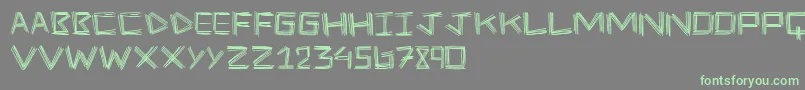 フォントStickFour – 灰色の背景に緑のフォント