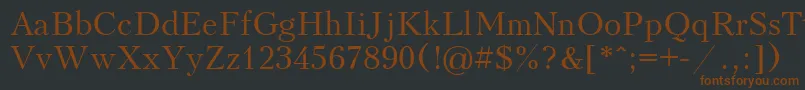 フォントKudriashov – 黒い背景に茶色のフォント