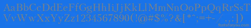 フォントKudriashov – 青い背景に灰色の文字
