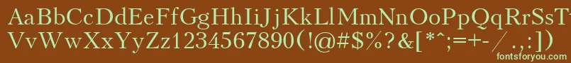 フォントKudriashov – 緑色の文字が茶色の背景にあります。