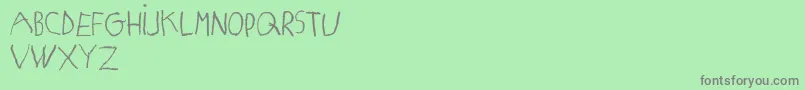 MatildasGradeSchoolHandDemoPrint Font – Gray Fonts on Green Background