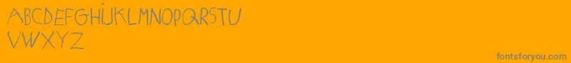 MatildasGradeSchoolHandDemoPrint-Schriftart – Graue Schriften auf orangefarbenem Hintergrund